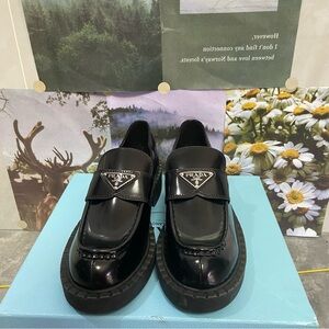 Prada Black Leather Penny Loafers with Silver Logo
